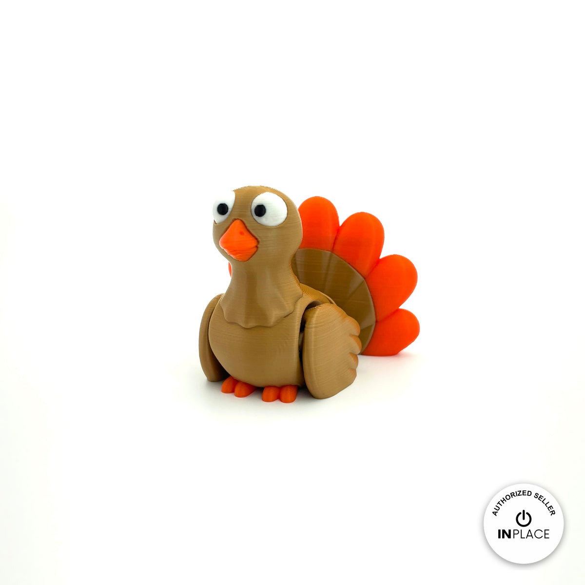 Cute turkey keychain, 3D printed by RU3D – three quarter view facing left. Brown with orange tail feathers.