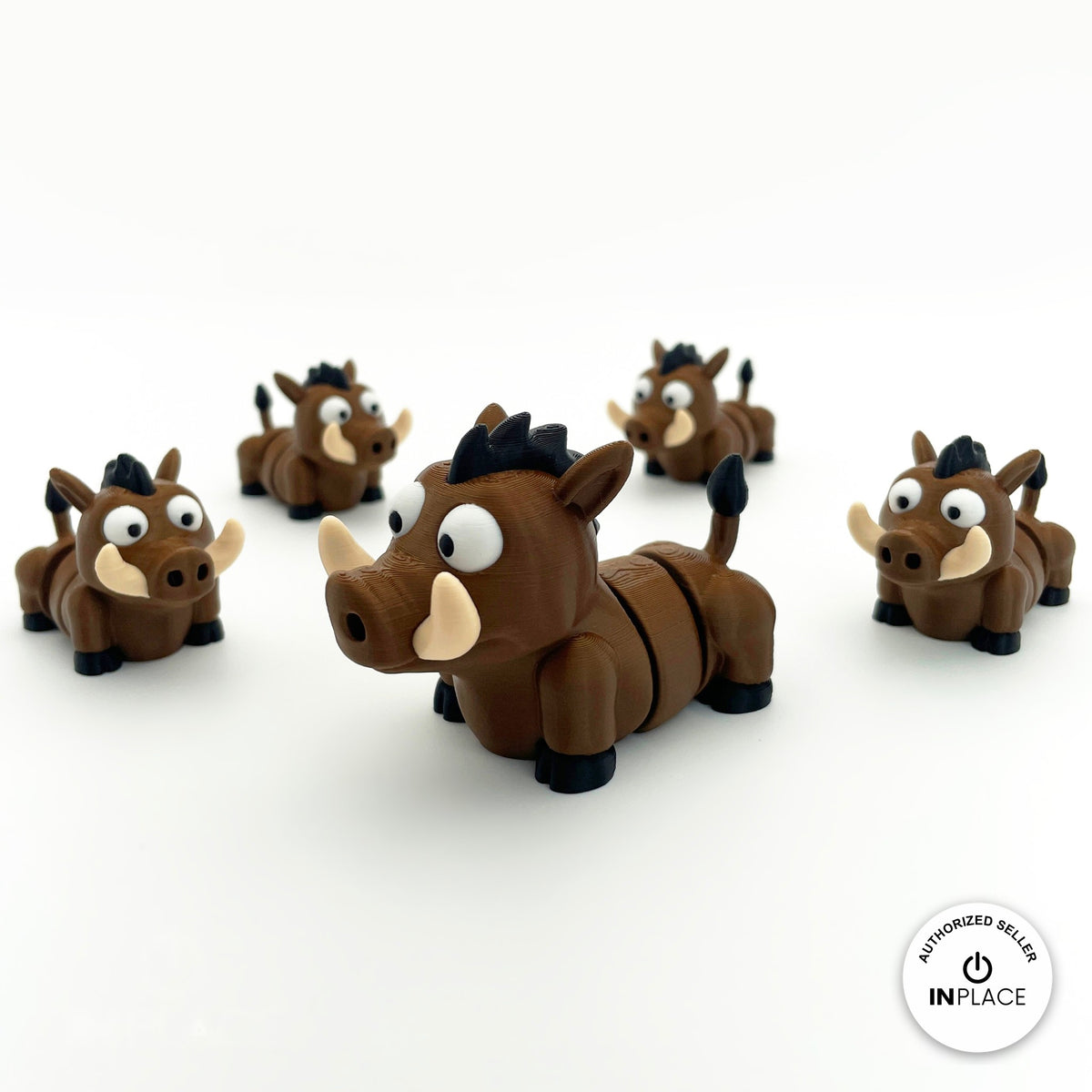 Cute warthog keychain, 3D printed by RU3D – group of warthogs facing left. Brown with cream tusks and black mane.