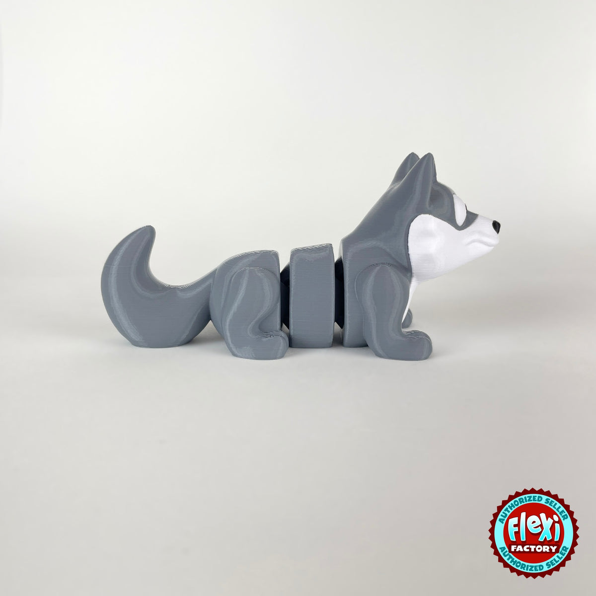 Cute wolf keychain, 3D printed by RU3D – side view facing right. Grey with white face.