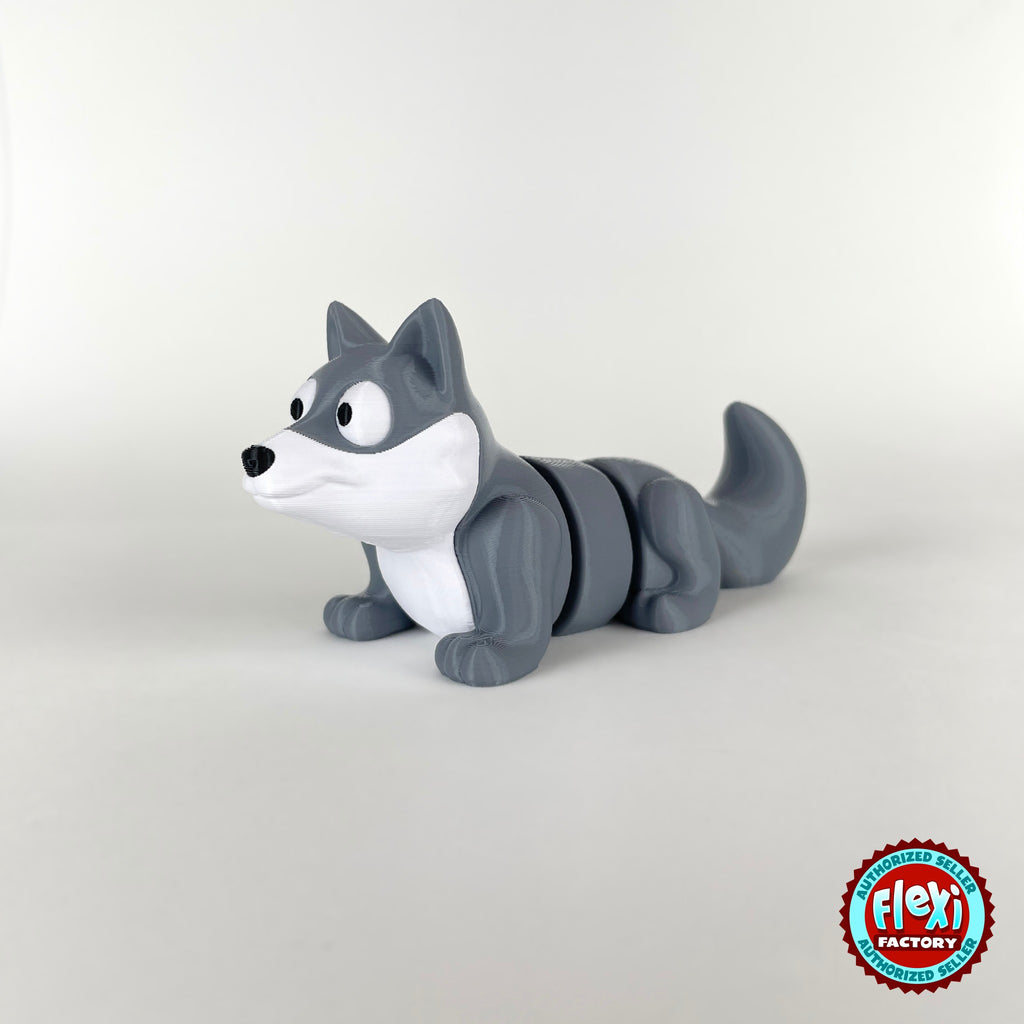 Cute wolf keychain, 3D printed by RU3D – three quarter view facing left tail up. Grey with white face.