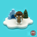 Cute woolly mammoth keychain, 3D printed by RU3D – front view with ice age playset. Brown with white tusks and ice age playset.