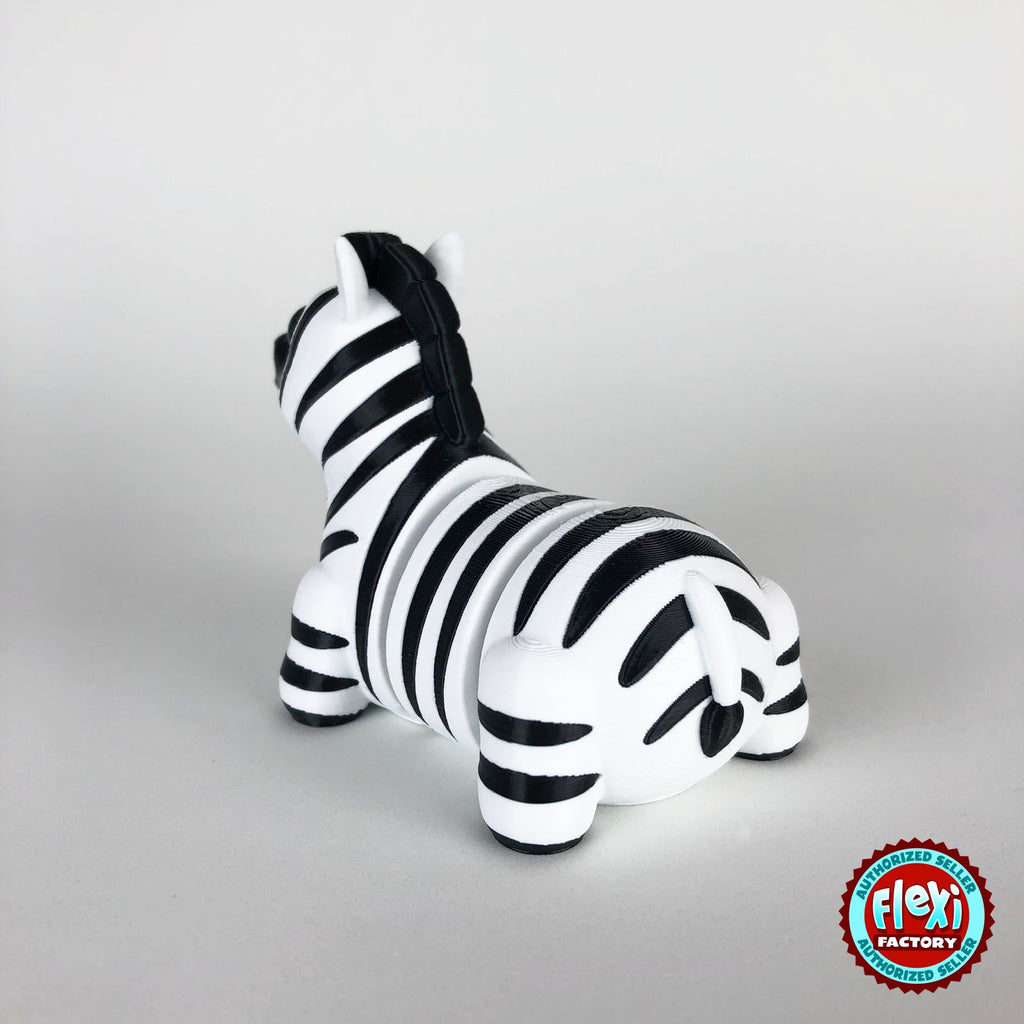 Cute zebra keychain, 3D printed by RU3D – dark eyes rear three quarter view. Black and white stripes.