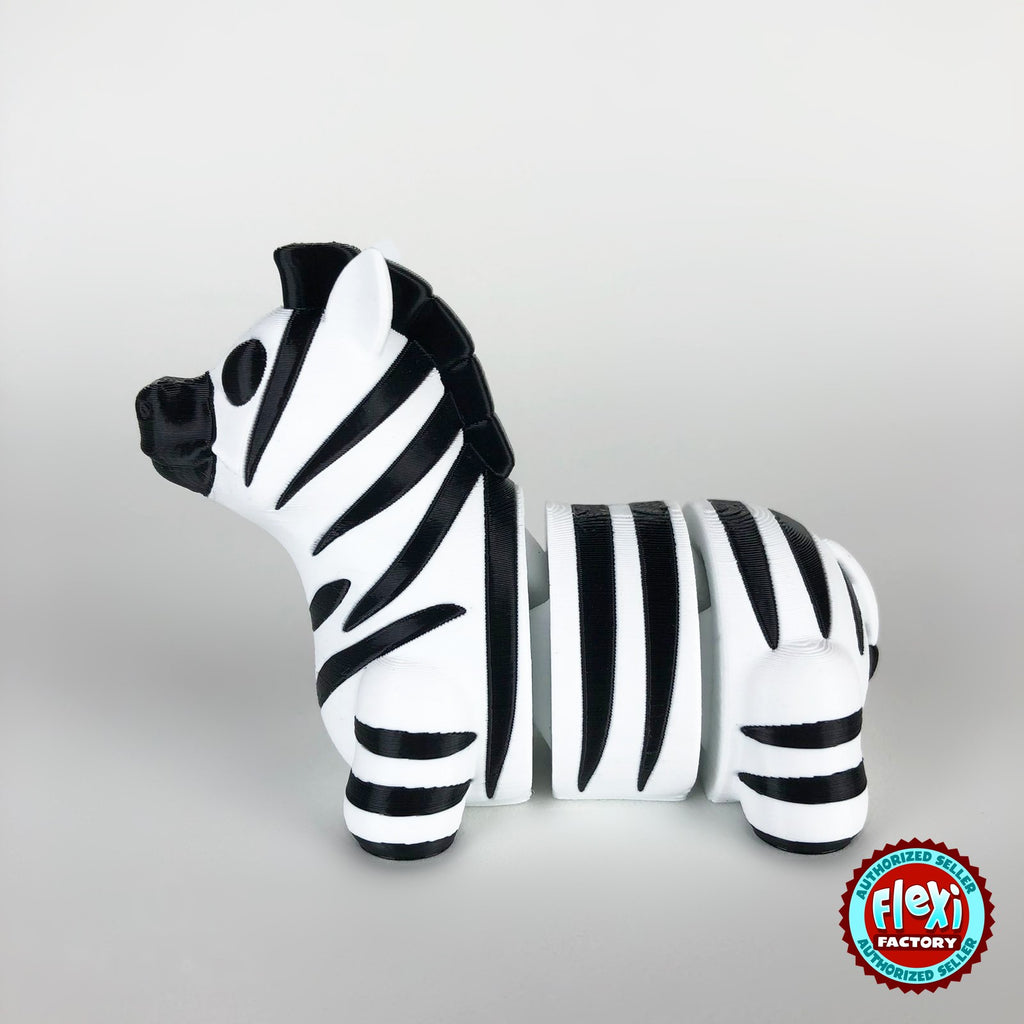 Cute zebra keychain, 3D printed by RU3D – dark eyes side view facing left. Black and white stripes.