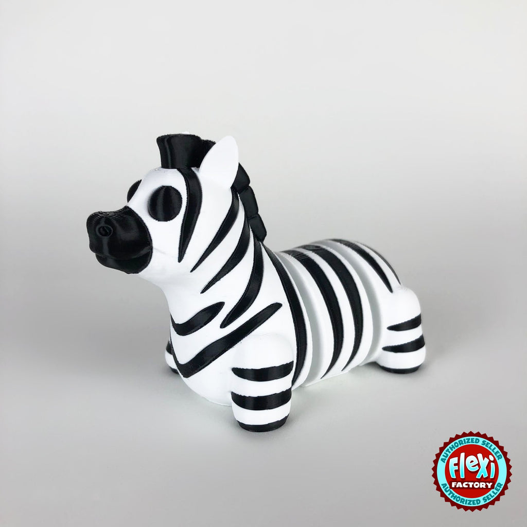 Cute zebra keychain, 3D printed by RU3D – dark eyes three quarter view facing left. Black and white stripes.