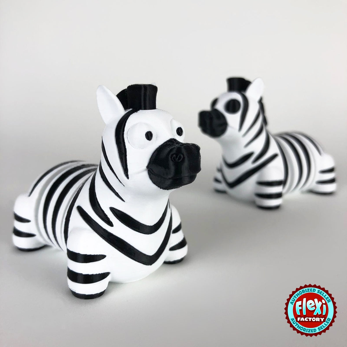 Cute zebra keychain, 3D printed by RU3D – pair of zebras. Black and white stripes.