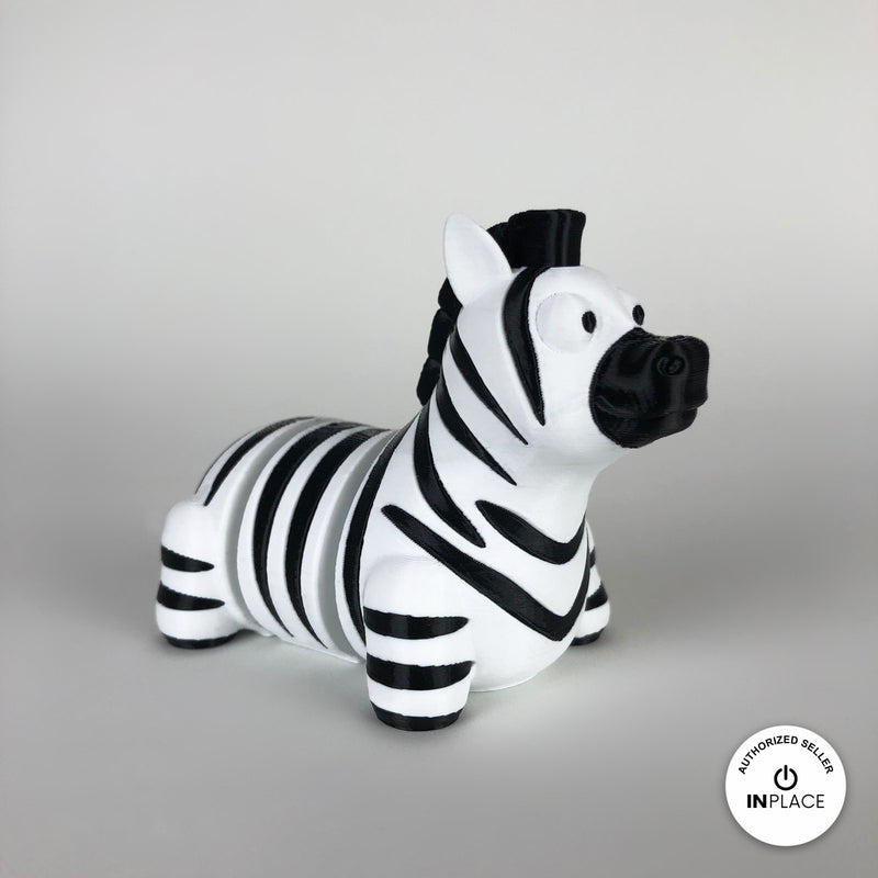 Cute zebra keychain, 3D printed by RU3D – three quarter view facing right. Black and white stripes.