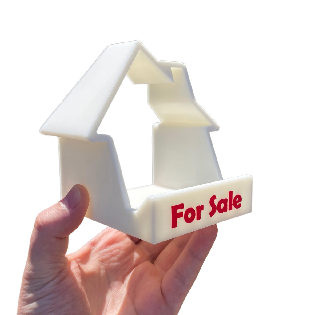 House-shaped For Sale phone and business card stand 3D printed by RU3D – angled view
