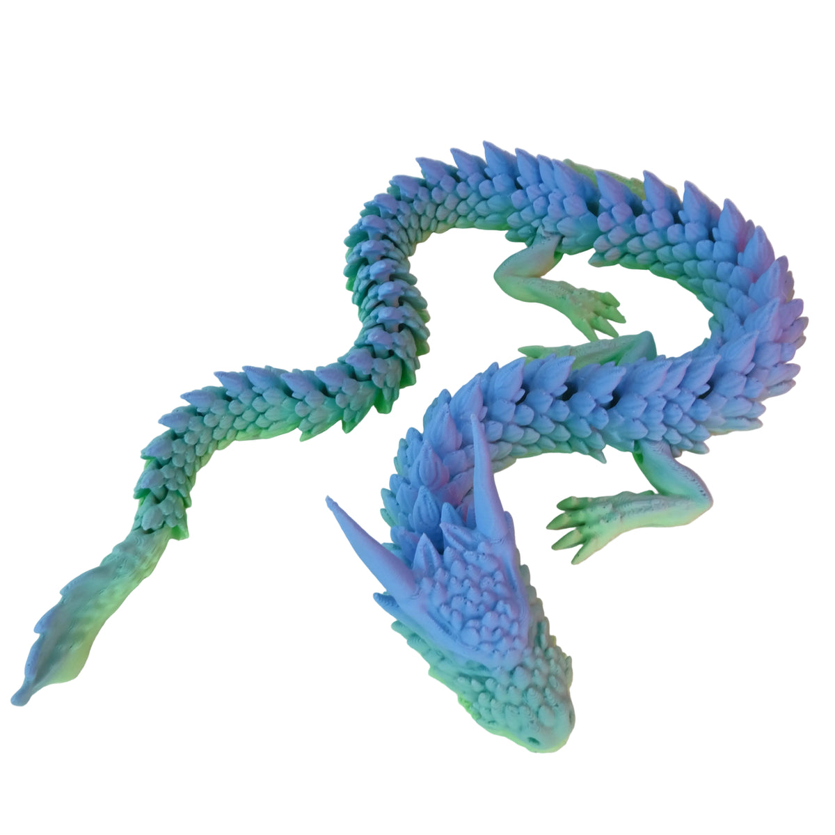 A smooth multi-colour dragon figurine with green and blue scales, featuring elongated horns and a serpentine body.