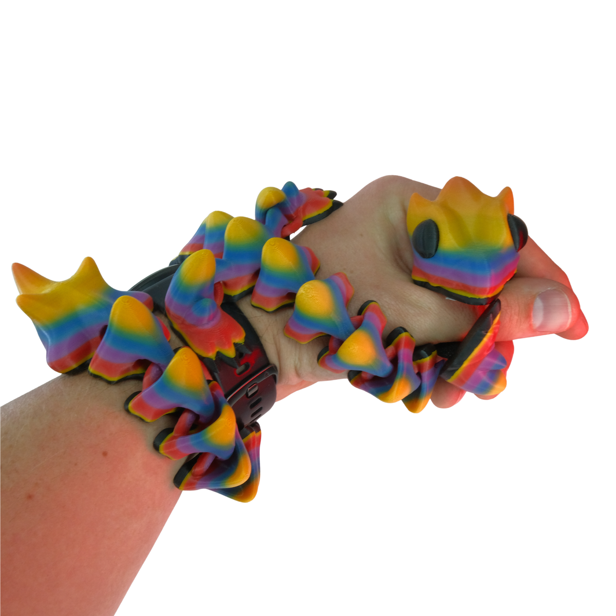 A colorful flexible fidget toy shaped like a series of connected curves, rainbow-colored with a smooth texture, held in a hand.