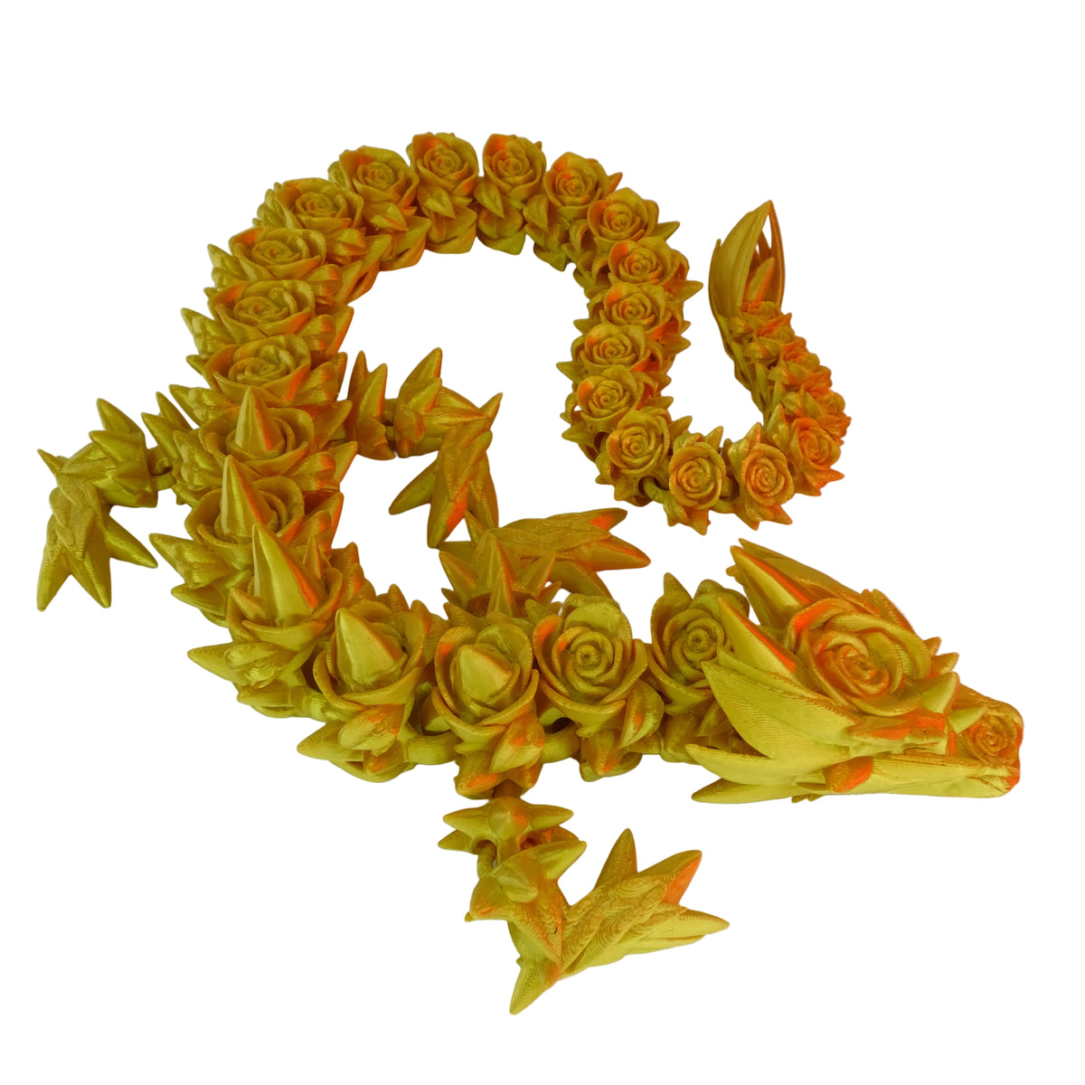 A yellow figurine shaped like a dragon, adorned with rose motifs along its body.