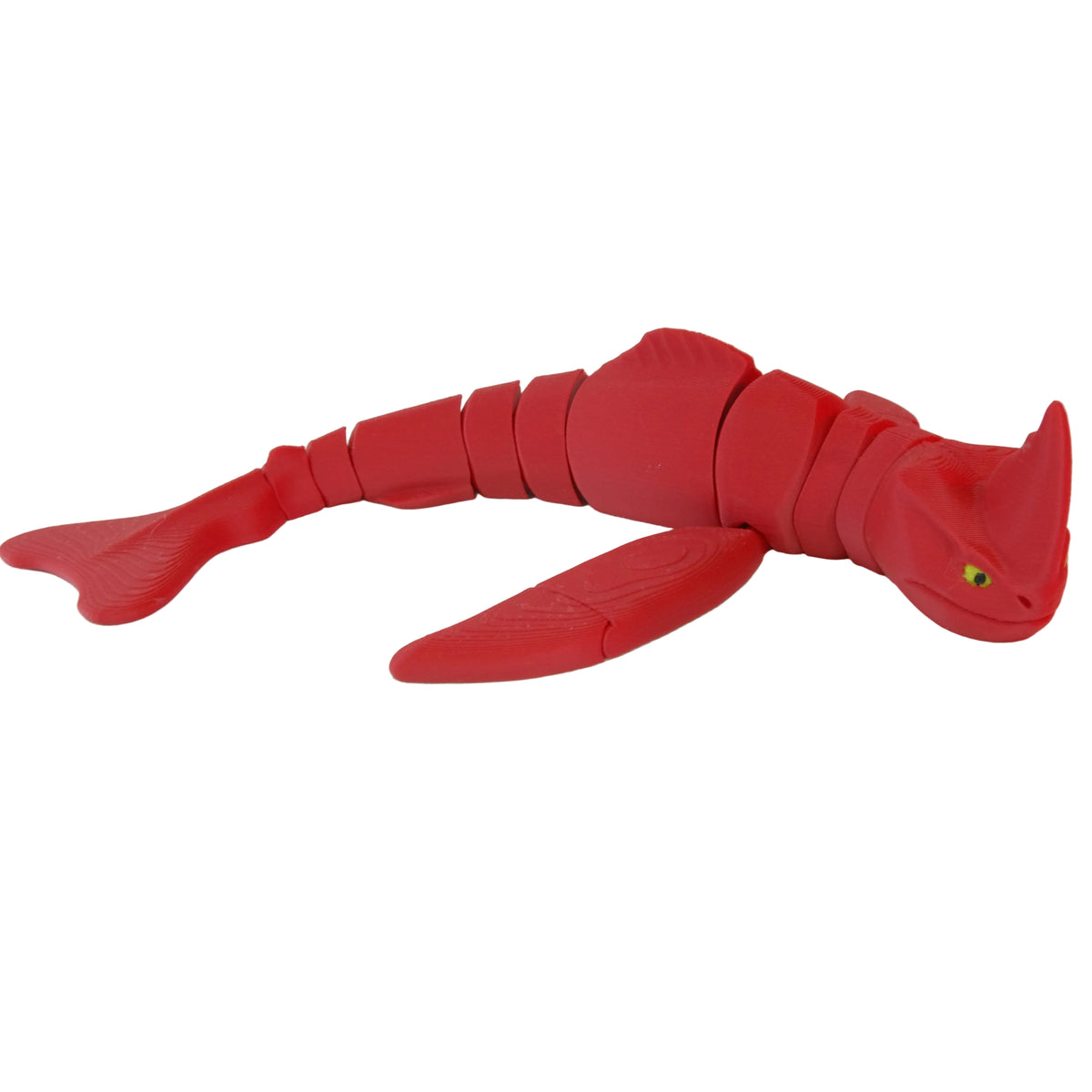A red articulated shark toy with smooth surfaces and visible joints for movement, featuring a green eye.