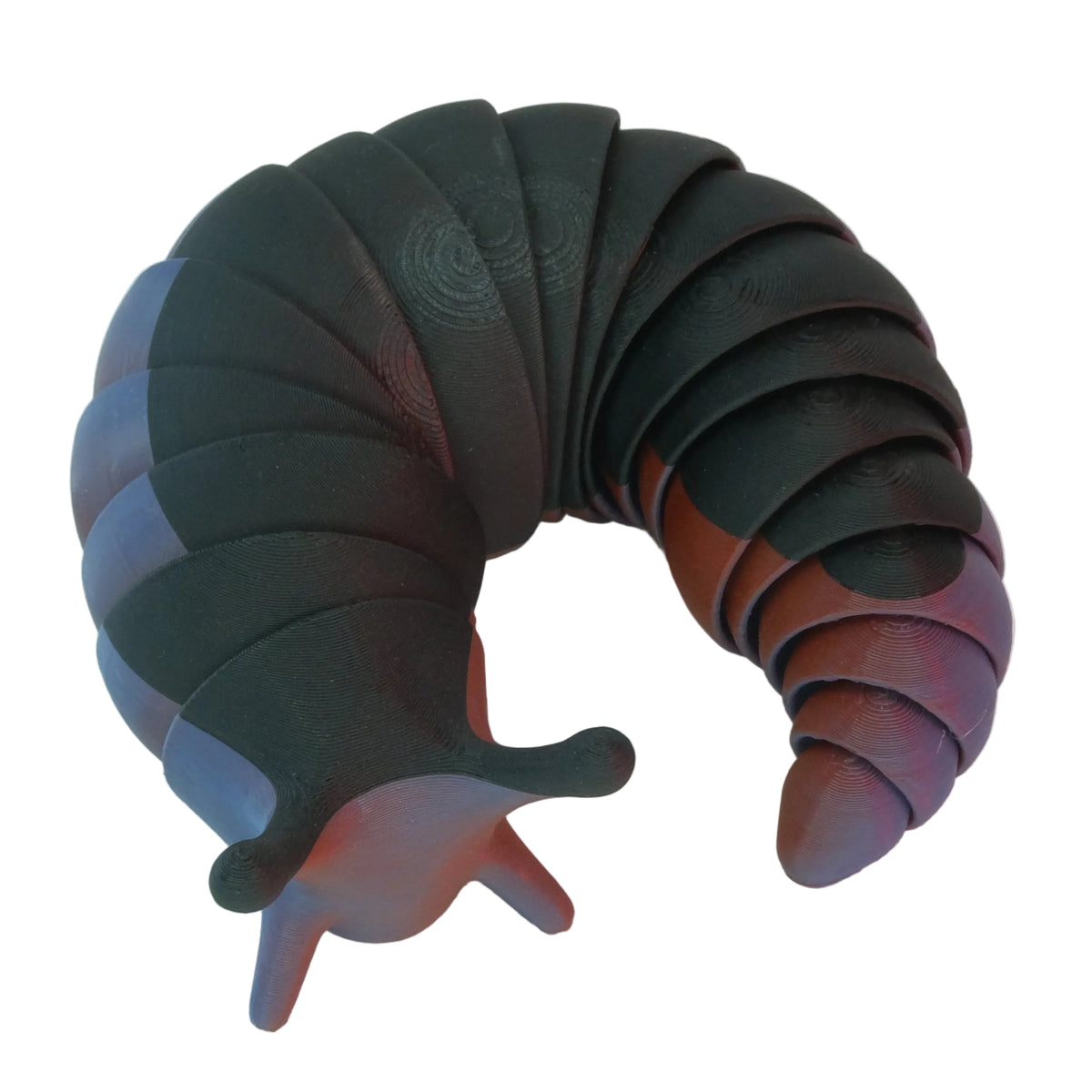 A flexible toy resembling a slug, primarily black with smooth texture and a curved shape.