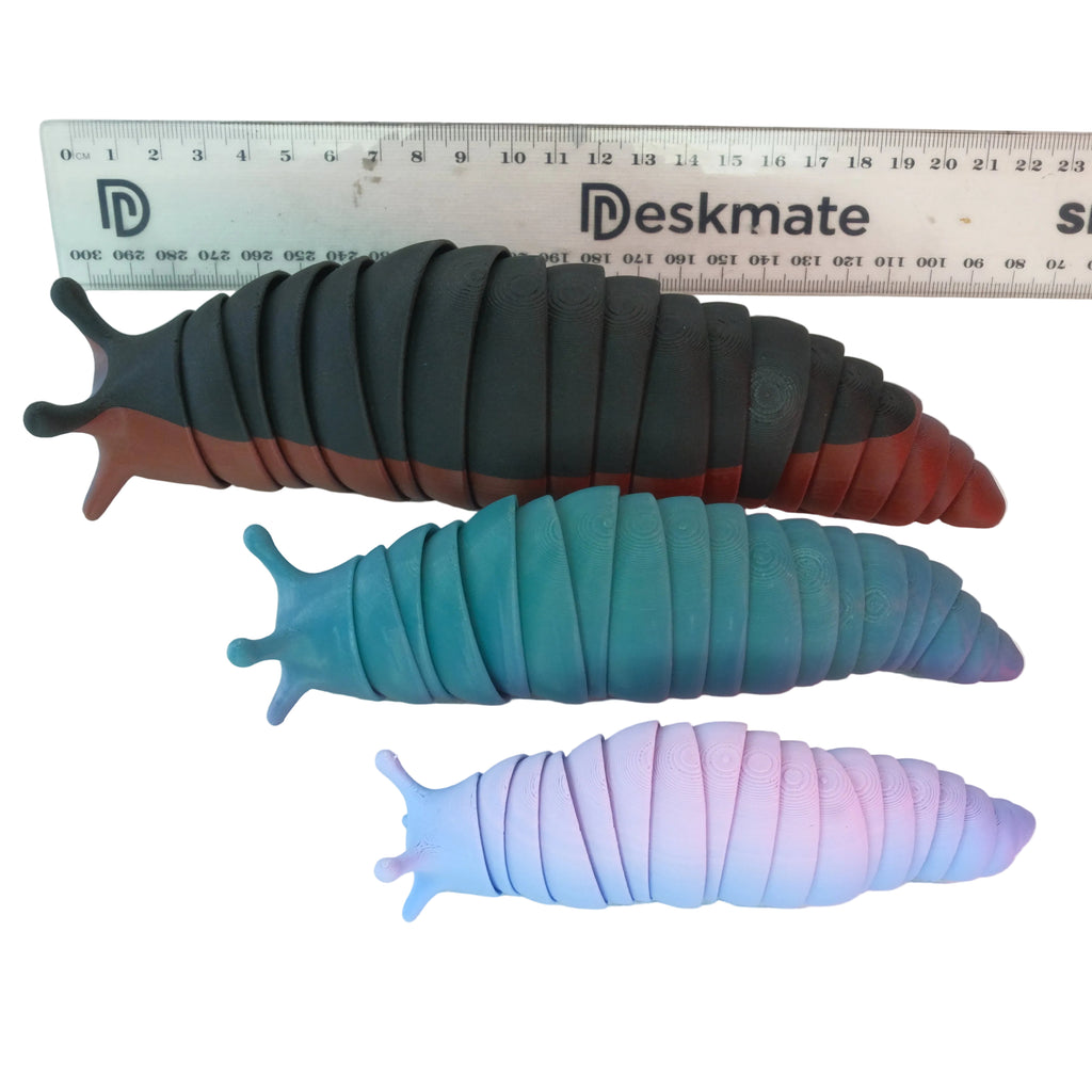 A set of three articulated slug-shaped fidget toys in various colors, with a smooth surface and segmented design, arranged on a white background.
