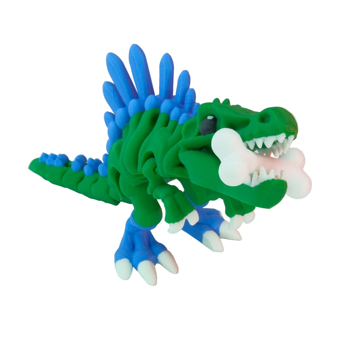 A green and blue articulated dinosaur flexi-figure with a spiky back and a white bone in its mouth, posed in a playful stance.