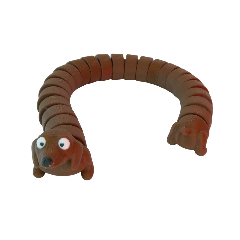 A flexible figure shaped like a dog, featuring a brown snake-like body with googly eyes and a head at one end.