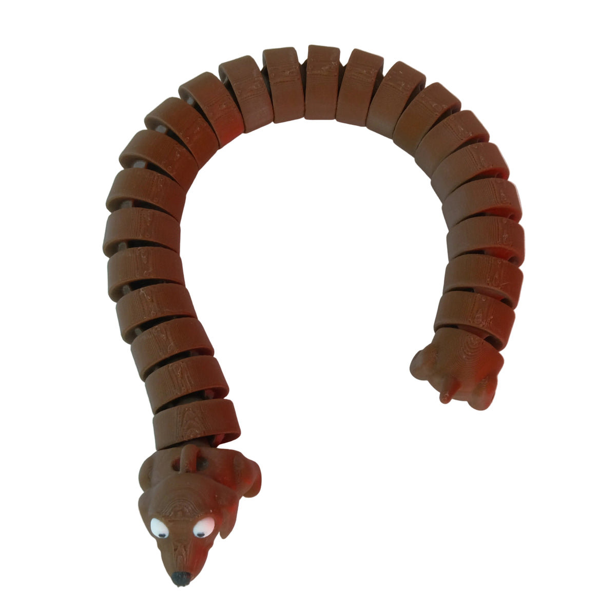 A flexible figure shaped like a snake, primarily red with a smooth surface, showcasing articulated segments along its body and a cute face with eyes and a snout.