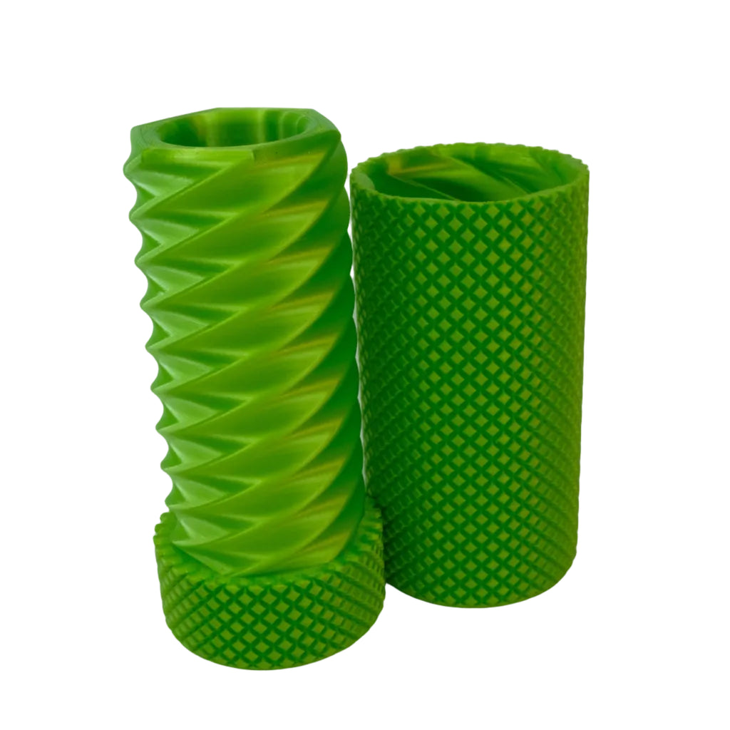 Two green textured cylindrical objects with different patterns standing side by side.