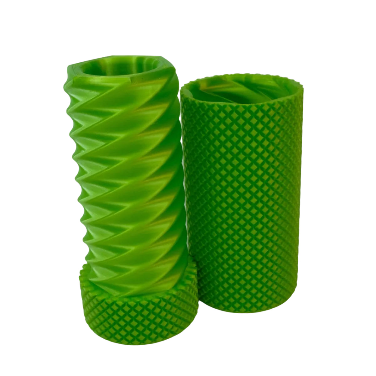 Two green textured cylindrical objects with different patterns standing side by side.