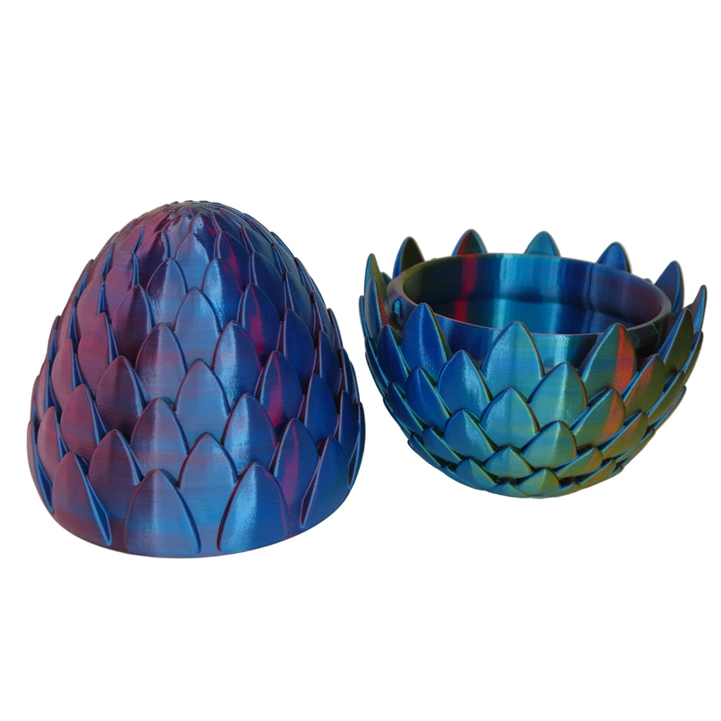 Two decorative bowls, one with a pointed shape and vibrant blue and purple colors, the other with a rounded shape and multicolored blue and green hues.