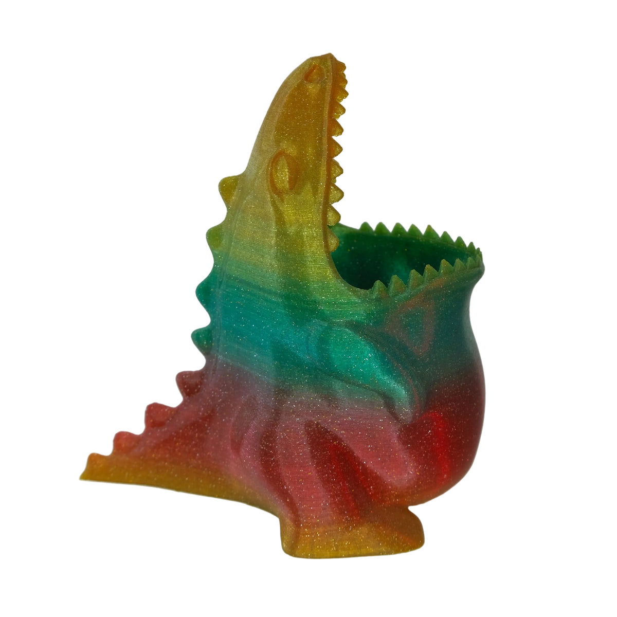 A multicolour dragon-shaped planter with a glossy finish featuring a green, red, and orange gradient.