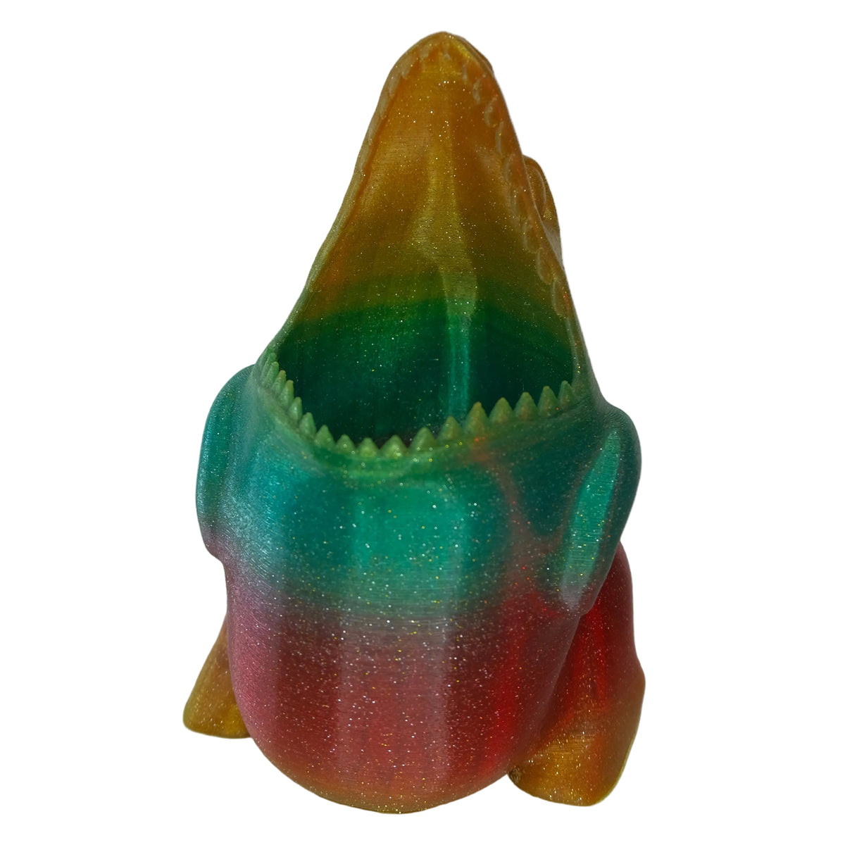 A multicoloured shark figurine featuring a glossy finish and an open mouth with sharp teeth.