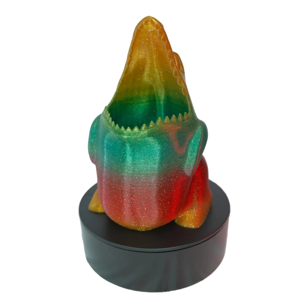 A multi-coloured glossy frog figurine featuring intricate details and a display base.
