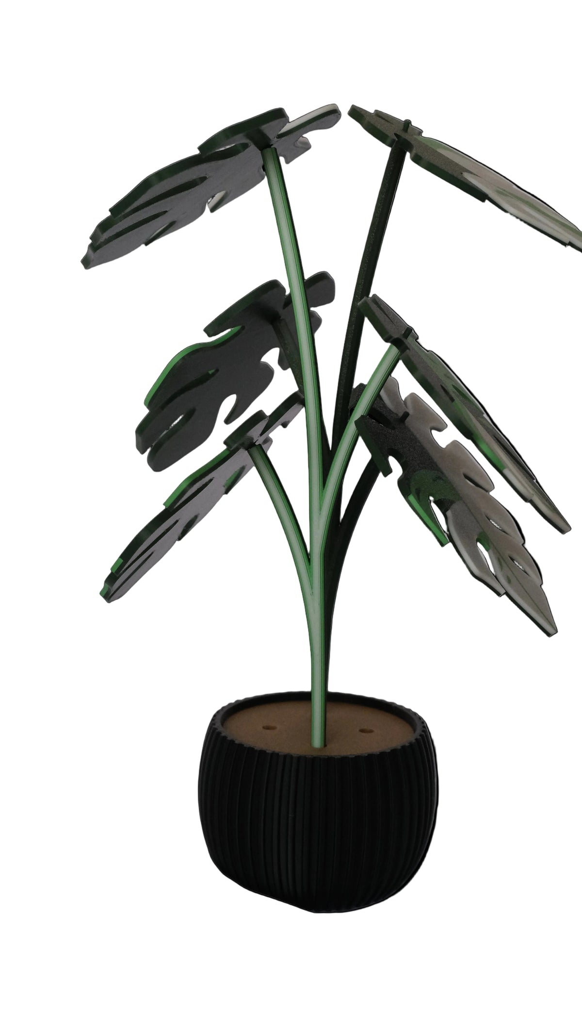 A decorative potted plant with green leaves shaped like a monstera, resting in a black ribbed planter.