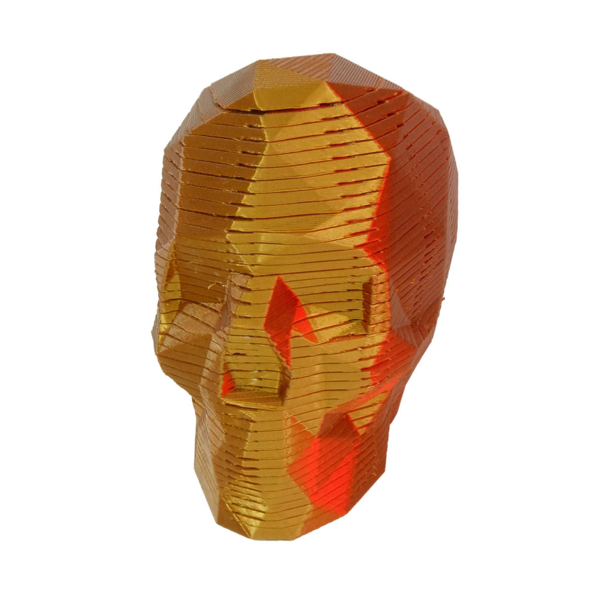 A geometric skull figurine in orange with smooth surfaces and layered design.