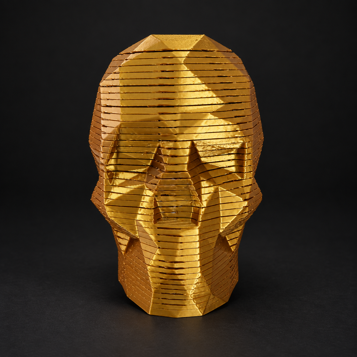Slingo Skull with stacked flexible layers displayed on a dark charcoal studio background.