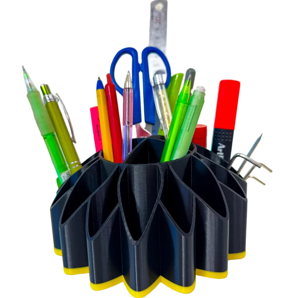 Black and yellow sunflower desk organiser 3D printed by RU3D, filled with pens, markers, scissors and a ruler