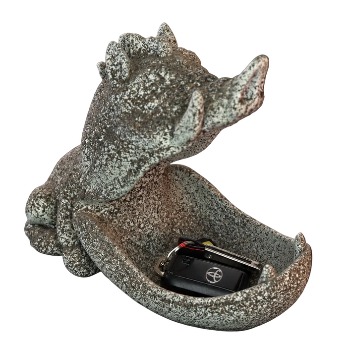 3D printed warthog key holder tray in a charcoal studio setting holding car keys.